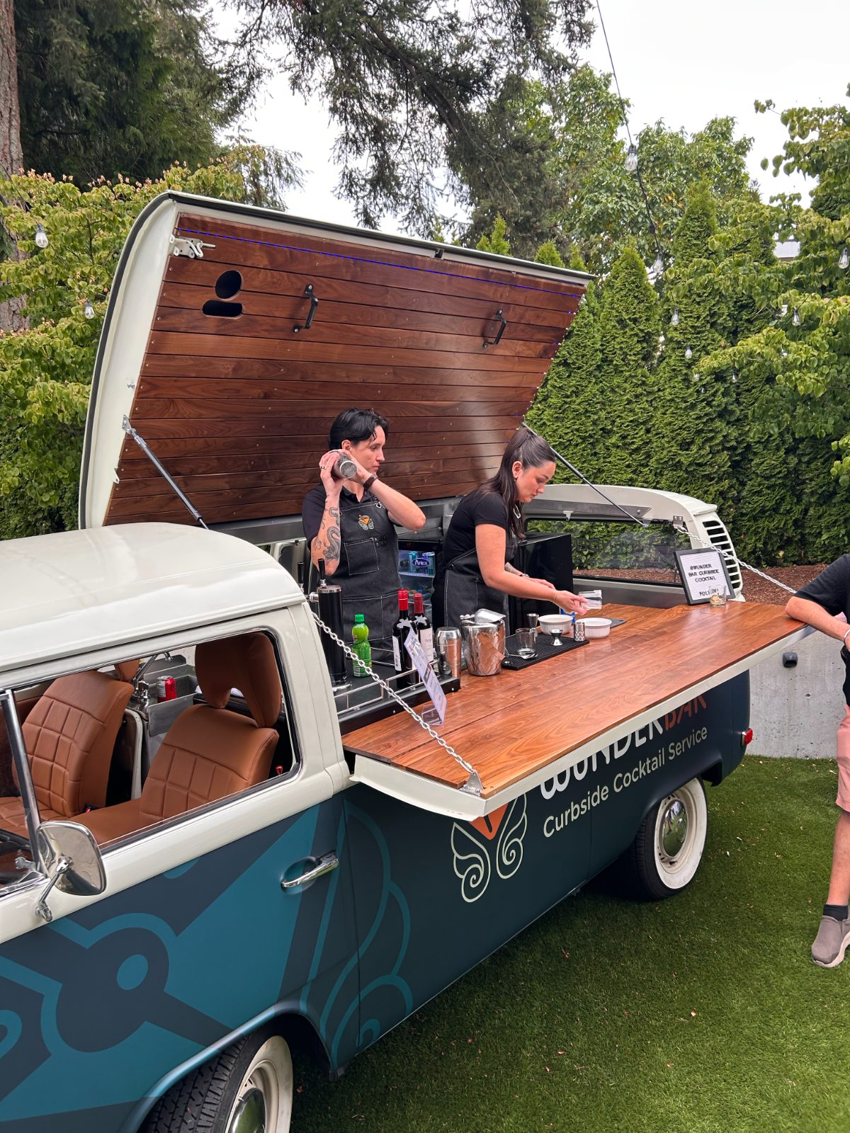 Bartenders shaking cocktails in the bus