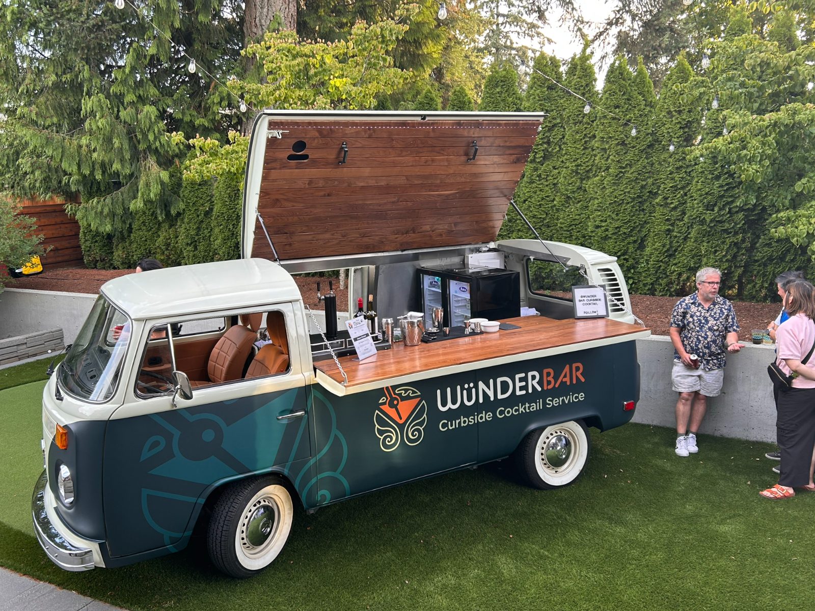 The Wünderbar bus with its bar lid open and walnut bar top set up